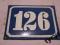 Przedwojenna tabliczka emaliowana numer dom 126