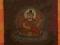 Grający Budda -rytualny obraz Tsakli wraz z mantrą