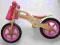 Nowy drewniany rowerek biegowy dla dziewczynki