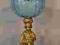 Naftowa lampa figuralna z błękitnym kloszem