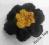 Wełniana broszka kwiat czarna żółta na szydełku