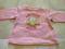 Różowy sweterek dla dziewczynki w wieku 6 miesięcy
