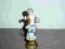 FIGURKA PORCELANOWA-Chłopczyk z owocami 15cm