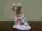 CHŁOPIEC Z ZAJĄCEM FIGURKA PORCELANOWA PUTTO
