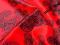 Czerwona satyna z lycrą w kółka. P115