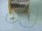 Guma w oplocie 1 mm k.srebrny  25 m G.962