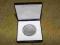Jakaś stara moneta w eleganckim pudełku po kolekcj