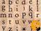 Zestaw drewnianych stempli - alfabet małe litery