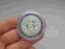 śliczna duża moneta w kapslu